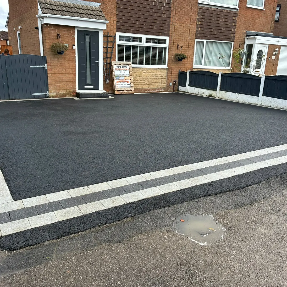 After: tarmac driveway with a two-tone block border