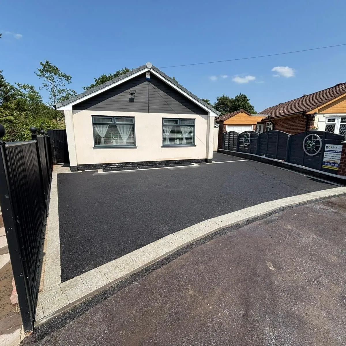 Tarmac driveway, rendered bungalow
