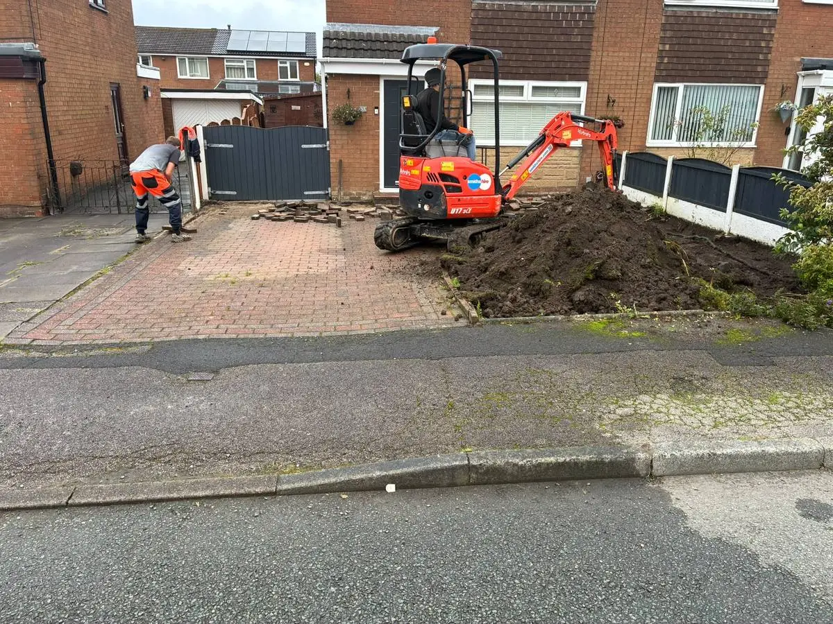 Before: lifting the old block paved driveway