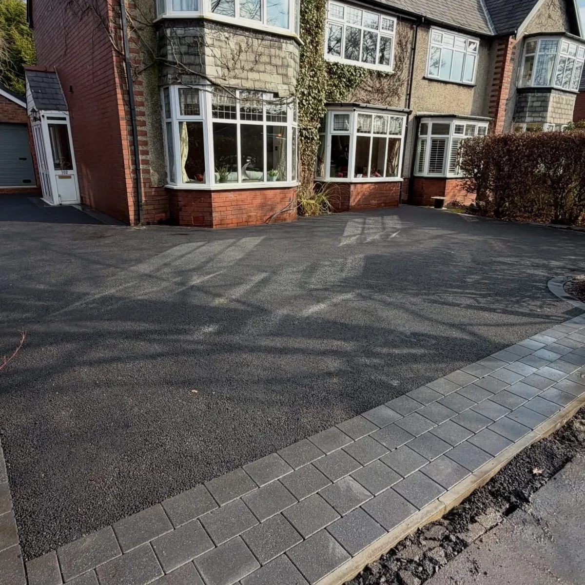 Tarmac driveway to the front of a home