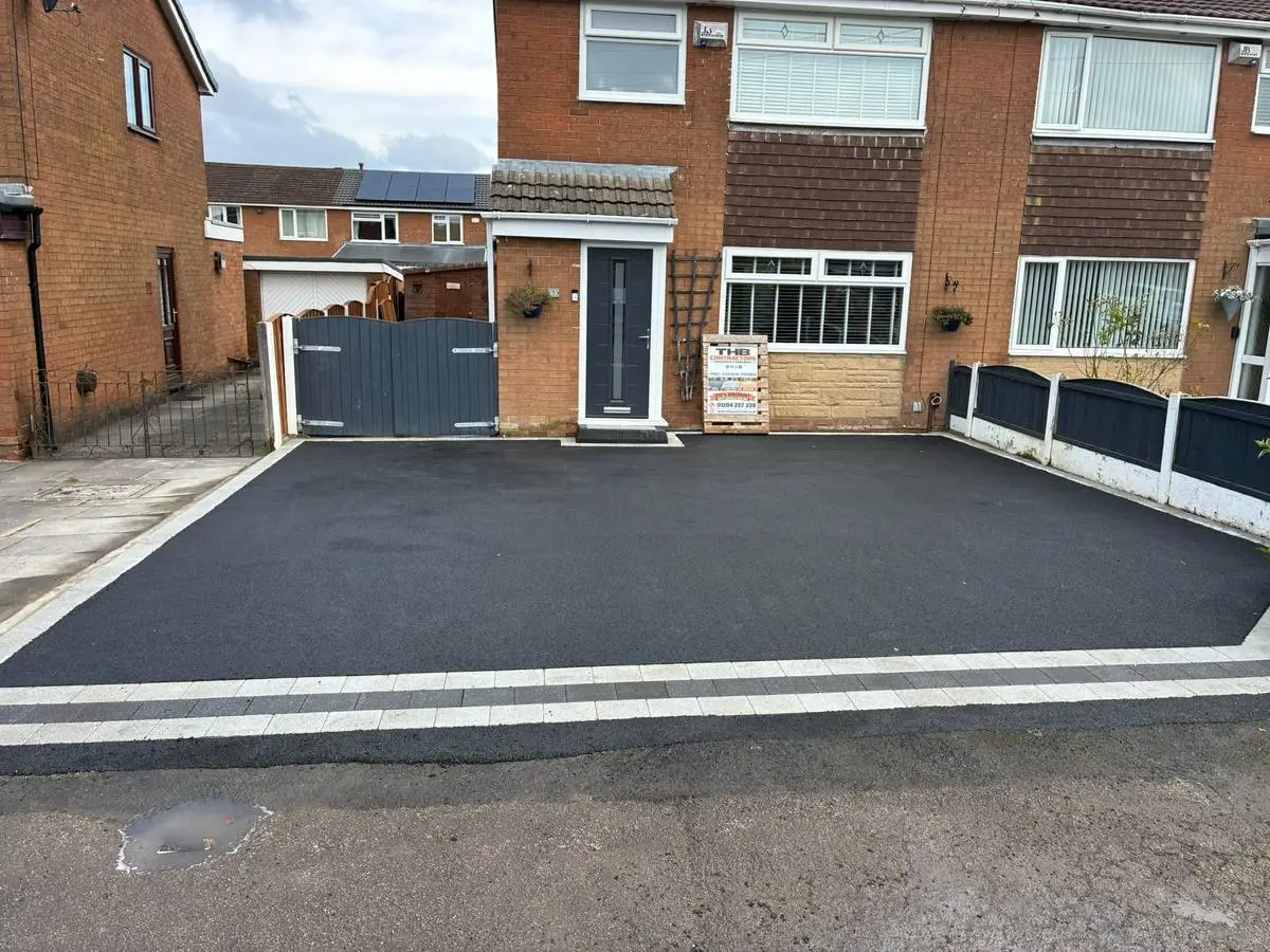After: the finished tarmac driveway with a silver and charcoal block border