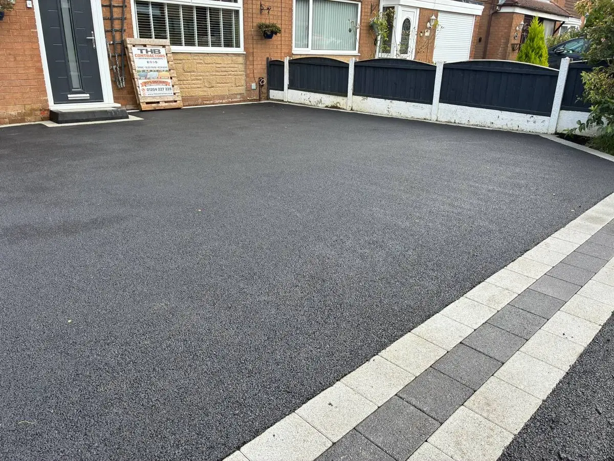 After: fresh tarmac surface and block edging, close up